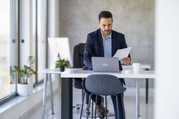 istock Business Professional Working at Laptop in Modern Office Setting 2182330170