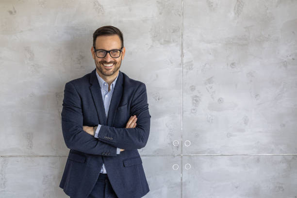 istock Confident Business Professional Smiling Against Gray Background 2182331940