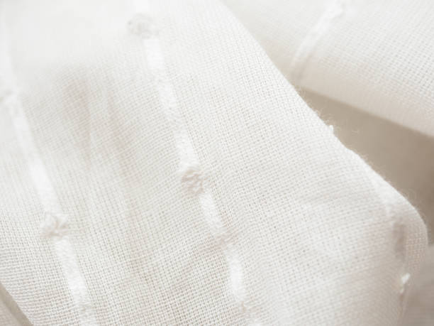 istock A close-up of a light translucent fabric that plays with the sun's rays, creating a feeling of lightness and airiness 2182335261