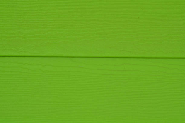 Close up details of bright lime green siding