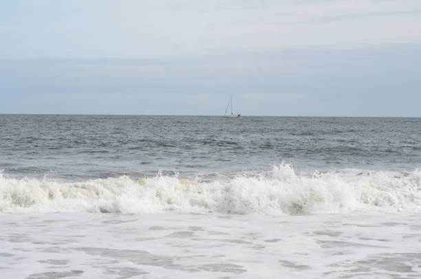 Ocean waves crashing on the beach in summer