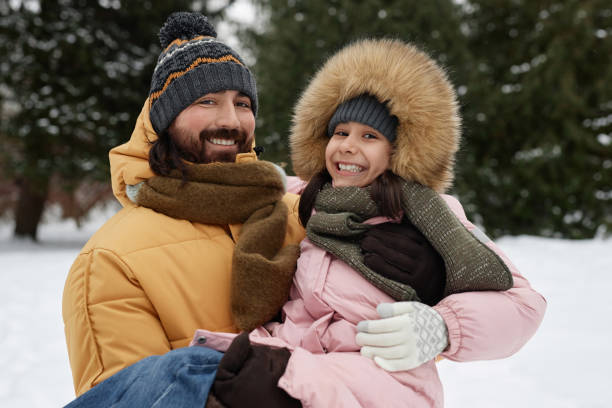 istock Happy Father Holding Daughter in Winter 2182339614