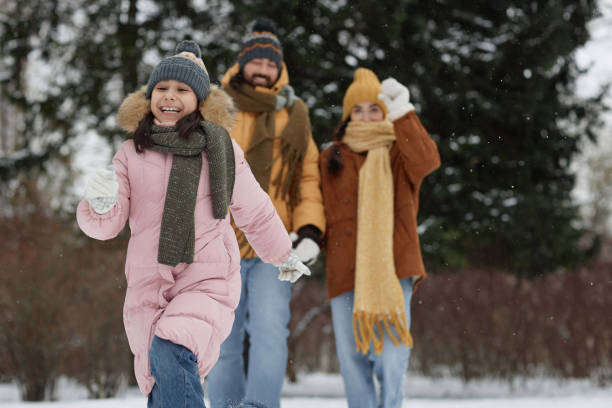 istock Cute Girl Running in Forest with Parents 2182339647