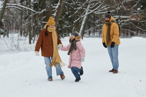istock Family Enjoying Walk in Winter Forest 2182339650