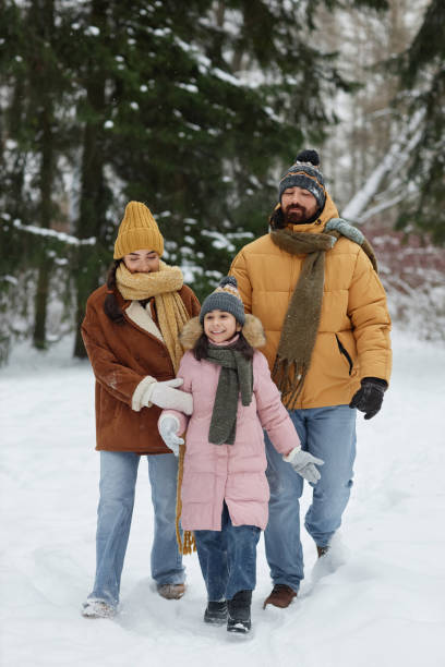 istock Happy Family Walking in Winter Park 2182339659