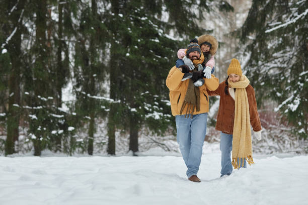 Family in Winter Forest