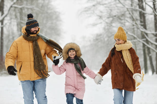 istock Playful Family in Winter Park 2182339678