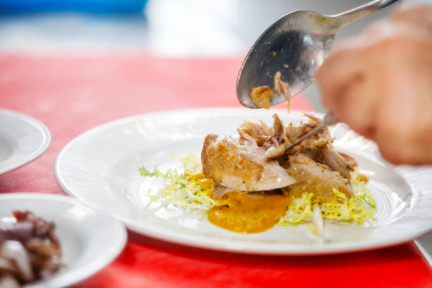 Chef is placing quail in a salad.