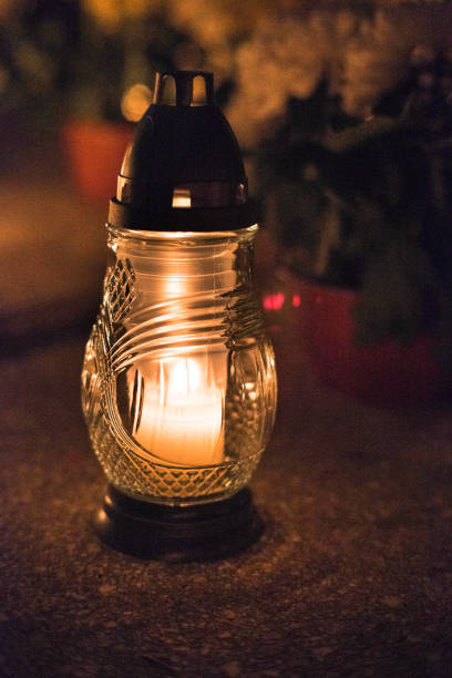 istock Candles on graves, the tradition of remembering people who have passed away. All Saints' Day. 2182351237