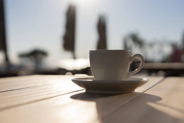 espresso or Turkish coffee on the table, hotel vacation by the pool, relax concept. summer background.