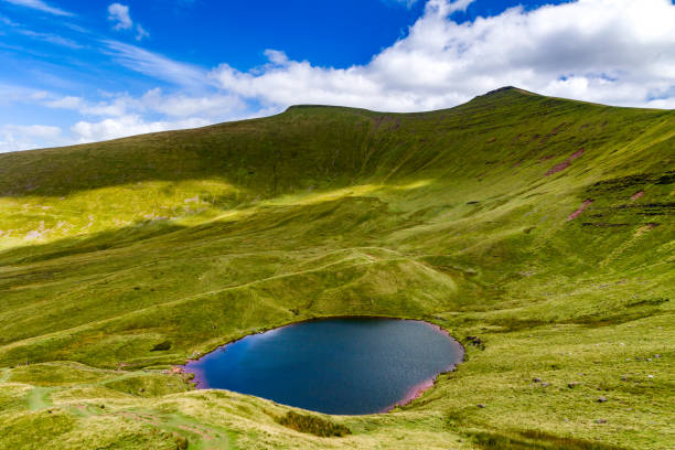 istock Small glacial formed lake beneath higher mountains 2182363041