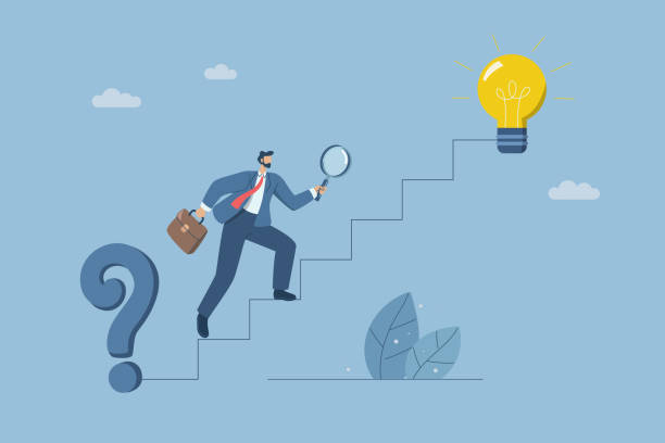 istock Businessman holding magnifying glass searching for solution to problem of stairs between question mark and light bulb, Finding the right direction or solution to a problem, Creativity to success. 2182367928