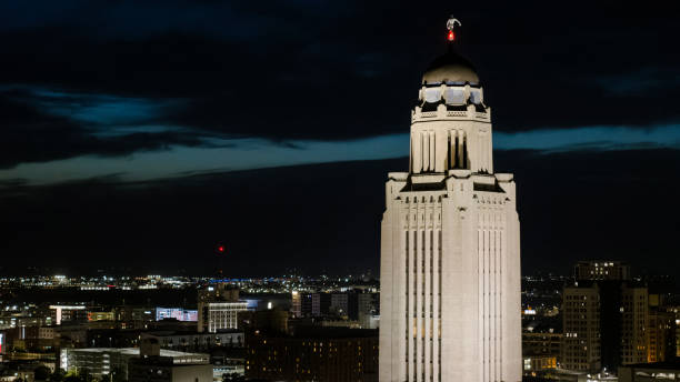 istock Towering landmark illuminates night. Nebraska State Capitol's Art Deco design dominates Lincoln skyline. 2182367986