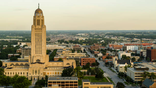 istock Architectural landmark in Downtown Lincoln, NE. Nebraska State Capitol Dome, with thunderbird mosaics, stands tall in city center as the morning appears 2182368021