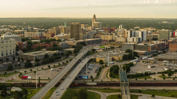 istock Interstate 180 traffic passes through Downtown Lincoln, NE with Nebraska State Capitol rising in distance 2182368048