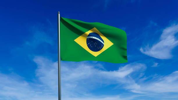 istock Brazilian flag fluttering in blue sky. 2182369945