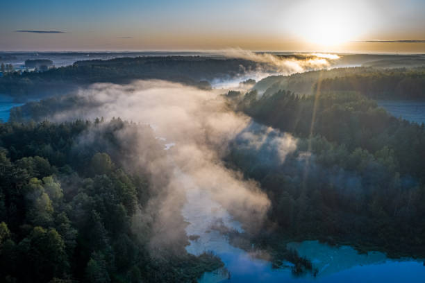 istock Mist over the river with sunrays, aerial view 2182371472