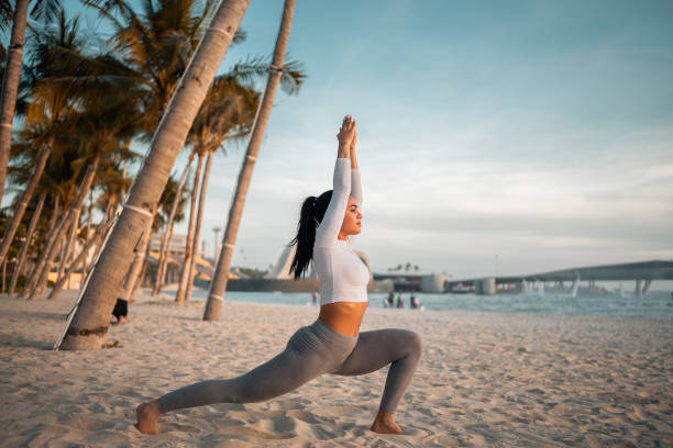 istock Serene Yoga Session on Beach During Sunset 2182375424