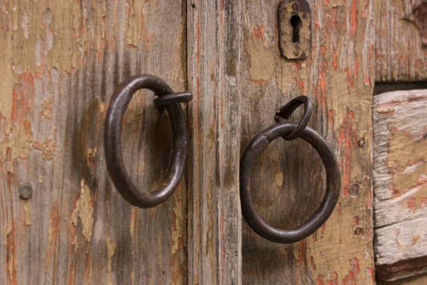 istock old wooden door with knocker 2182391178