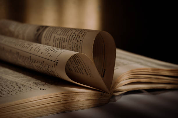 istock An old book folded in a heart shape in a low light place 2182392797