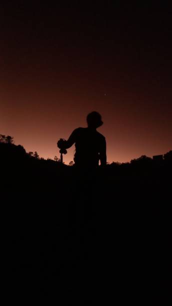 istock sunrise on the mountain with people climbing 2182394568