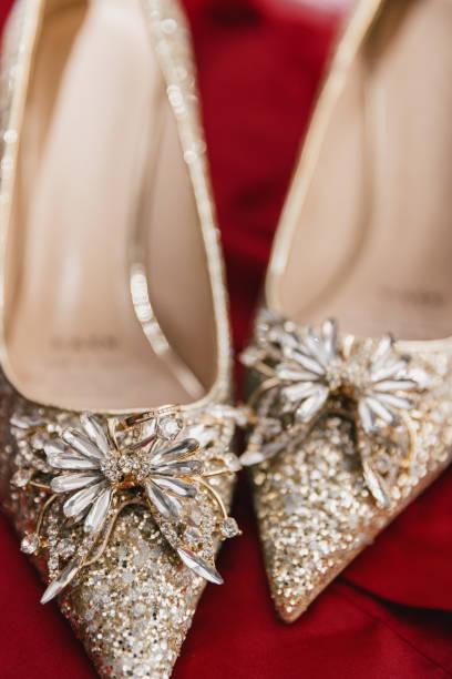 Close-up photography of wedding shoes on red silk, high heels, Chinese wedding