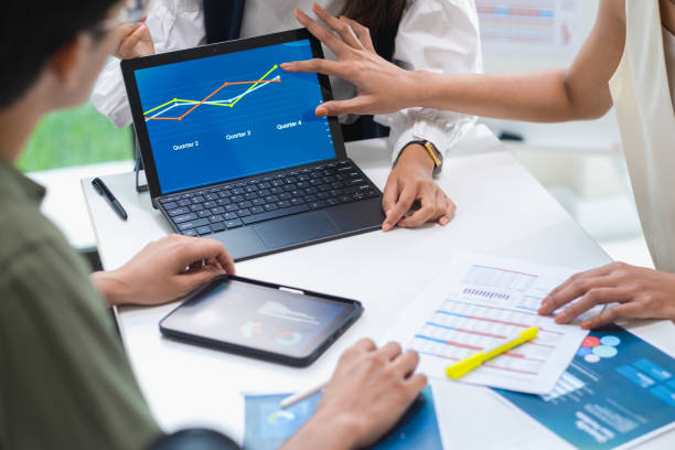 istock team of financial discussion business planning, analyzing digital financial data and strategy in a modern office 2182396968