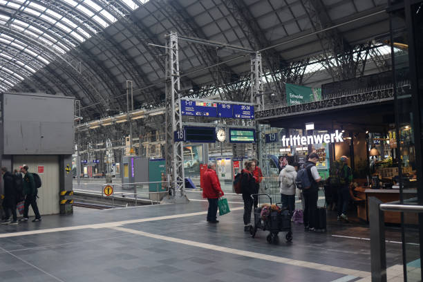 The expansive concourse at Frankfurt Central Station combines the energy of busy train platforms with a lively selection of shops and dining options. Here, travelers and locals alike experience a seamless blend of transit convenience and retail offerings, with everything from quick bites to essential services just steps away from the platforms. This dynamic space captures the essence of Frankfurt, providing a welcoming and practical hub for those on the move.