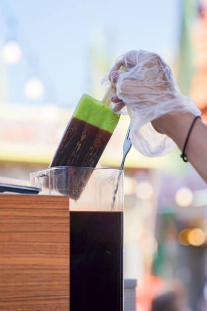 istock Es Goyang, or traditional ice lolly, is served with tempting chocolate 2182398028