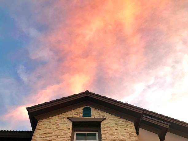 Front house roof with beautiful sunset sky