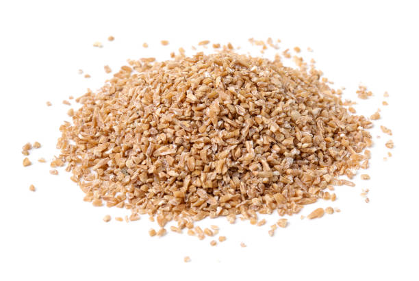 istock Pile of dry wheat groats isolated on white 2182409570