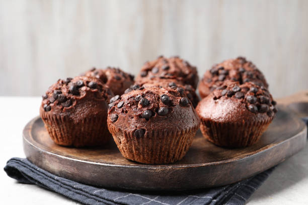 istock Tasty chocolate muffins on grey table, closeup 2182410921