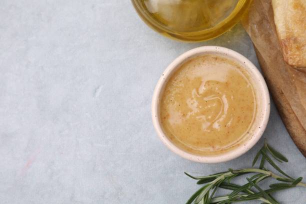 istock Delicious turkey gravy and rosemary on grey table, top view. Space for text 2182411206