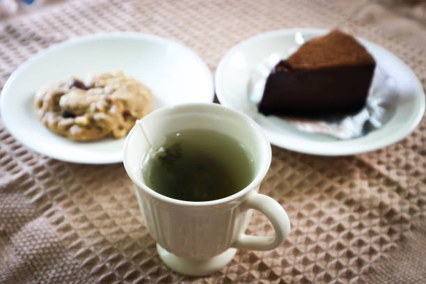 hot tea , cookie and cake on the table or tea time or hot green tea