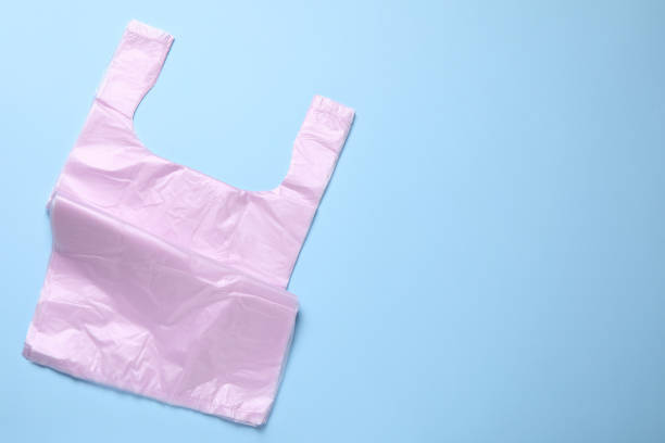 istock Pack of plastic bags on light blue background, top view. Space for text 2182414761