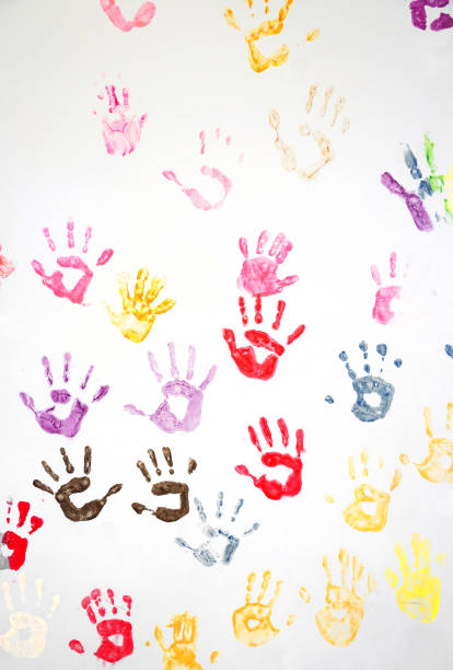 istock Colorful hand prints on the white wall 2182416252