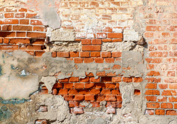 istock A brick wall with a few holes in it 2182416337