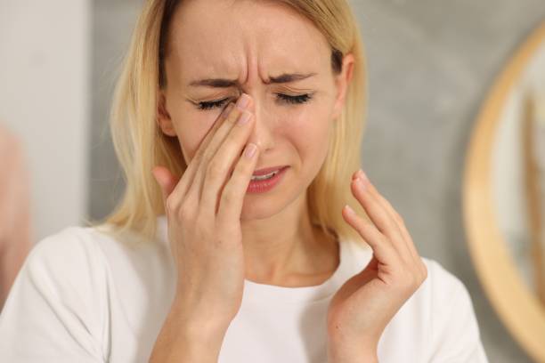 istock Sad woman with smeared mascara crying indoors, closeup 2182417954