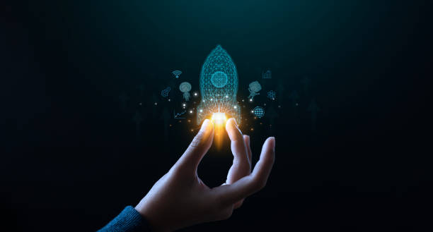 istock A hand reaching out to touch a glowing energy source, representing creativity, magic, and potential amidst a dark background. 2182418395
