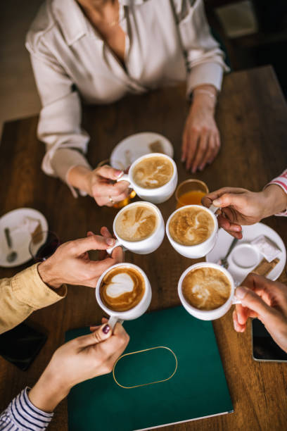 istock Top view of group of people drinking coffee. 2182421016