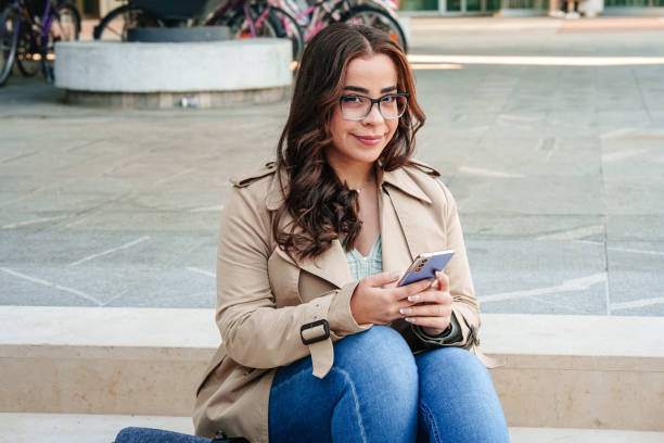 istock Middle Eastern Businesswoman Texting on Smartphone Outside 2182422906
