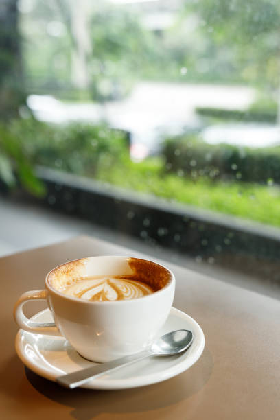 istock Cup of hot latte coffee on table 2182431499