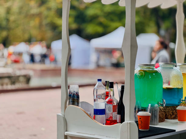 istock Outdoor Beverage Stand with Colorful Drinks 2182436666