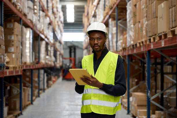 istock Warehouse worker managing inventory with digital tablet in logistics center 2182439238