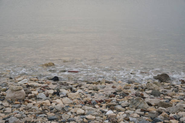 sand and stones on the beach at Sliema, Malta