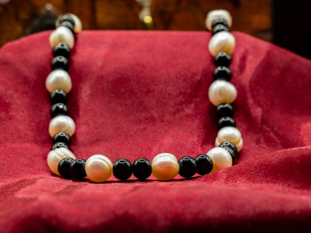 istock display of ancient medieval colored pearl necklace on a red fabric 2182447626