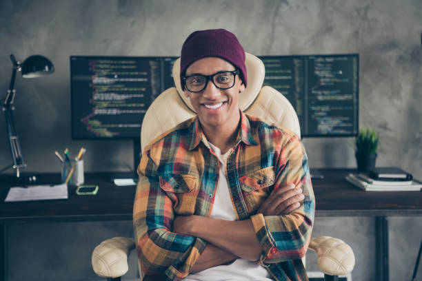istock Portrait of positive professional hacker sitting chair crossed hands server optimization workplace indoors 2182457690
