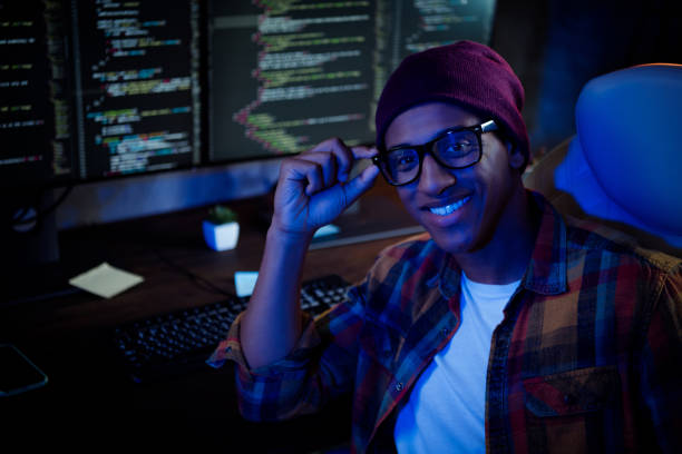 istock Portrait of positive handsome guy sit chair hand  touch eyeglasses server security optimization evening workstation indoors 2182457774