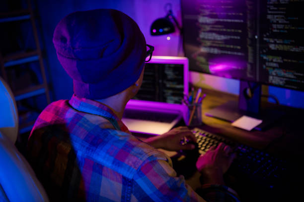 Rear behind photo of pc operator sitting chair keyboard typing writing microsoft workplace indoors