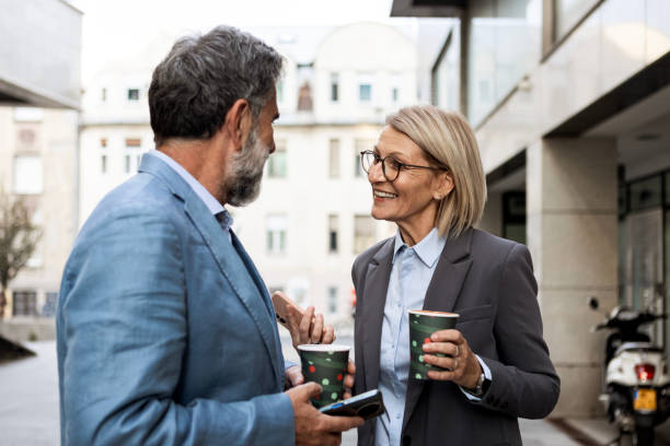 istock Colleagues Connecting Over Coffee in the Sun 2182460220